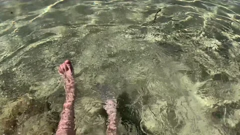 Inspiring closeup of active boy s legs doing bycicle movements while sitting on  Stock Footage 162658259