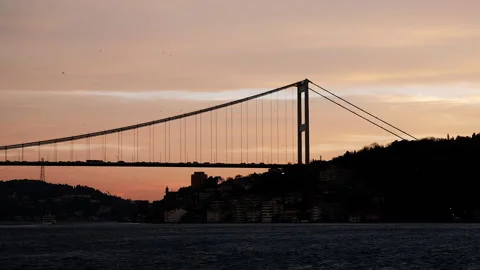 Inspiring panorama of cable-stayed bridge across Bosphorus. Sunset sea Stock Footage 253569769