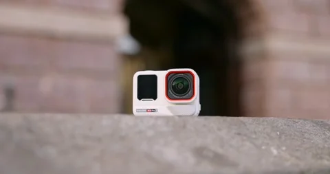 Insta360 Ace Pro action camera on stone wall. Close up, rack focus Stock Footage 341455619