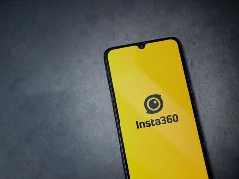 Insta360 app launch screen on smartphone on dark marble stone background Stock Photos