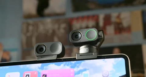 Insta360 Link 2 Pro And 2C Pro Webcams Mounted On A Laptop Showing The Camera Stock Footage 328391644