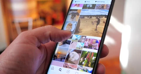 Instagram app scrolling through social media networking feed Stock Footage 136636192