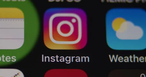 Instagram App on Smartphone. Macro close up. Swipe to and open App Stock Footage 149546535