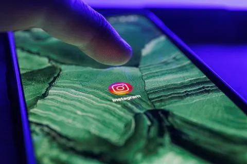 Instagram app on smartphone screen. Close up shot of instagram app Stock Photos
