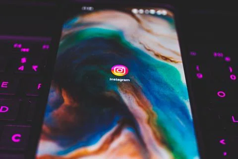 Instagram app on smartphone screen. Close up shot of instagram app Stock Photos