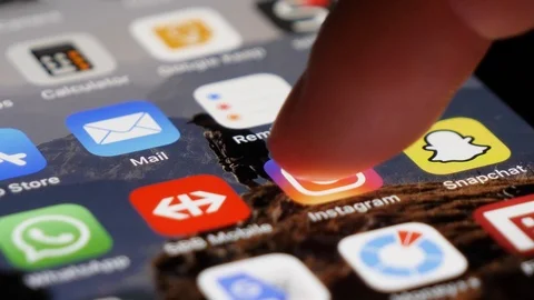 Instagram Application Opening, User Scrolling through Pictures Stock Footage 123674918