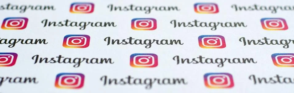 Instagram pattern printed on paper with small instagram logos and inscription Stock Photos