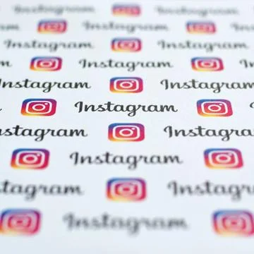 Instagram pattern printed on paper with small instagram logos and inscription Stock Photos