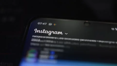 Instagram social network app by meta scroll in the phone screen display. Stock-Footage 237436226