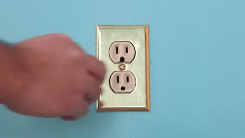 Install electrical outlet with electricity safety cover to prevent child Stock Footage 146487052