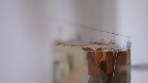 Install a new window. Work widens the window opening to the desired dimensions Stock Footage 91777468