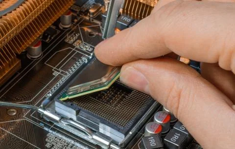Install processor in to cpu socket Stock Photos