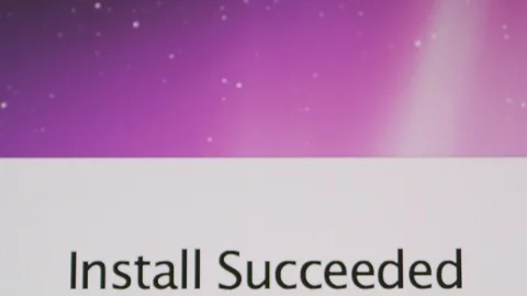 Install Succeeded message on Apple MacOS on iMac computers Stock Footage 107783334