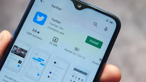 Install the twiiter app from smart phone Stock Footage 162333516