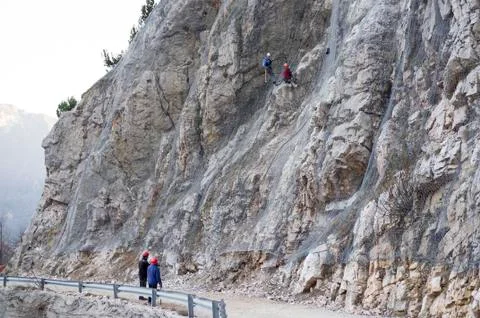 Installation of active galvanized wire rope mesh system Stock Photos