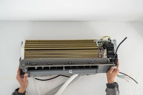 Installation air conditioning system in room with white wall in apartment Stock Photos