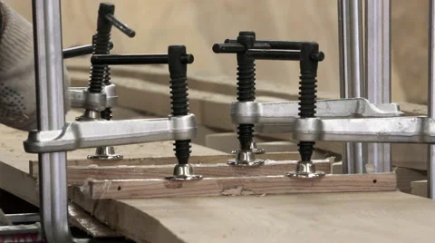 Installation and adjustment of discs for gluing two wooden surfaces to create Stock Footage 62009625