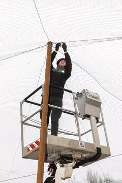 Installation of anti-drone protection nets in Kherson Stock Photos