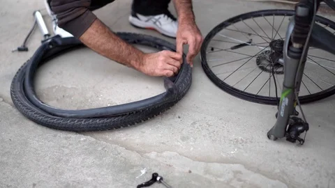 Installation of a bicycle wheel with camera installation Stock Footage 129517283