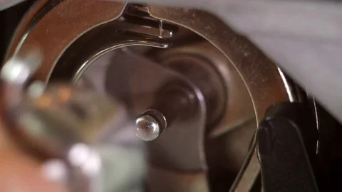 Installation of a bobbin case in the shuttle of a sewing machine Stock Footage 82381310