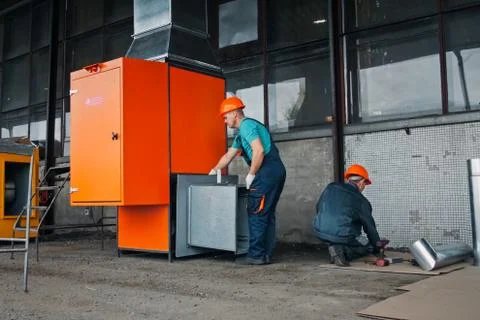 Installation of branching system by workers. Stock Photos