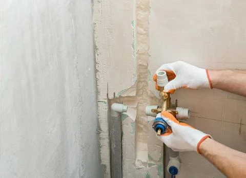 Installation a built-in shower. Stock Photos