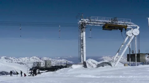 Installation of cable mounted on the upper plateau of snowy mountains that wo Stock Footage 68941373