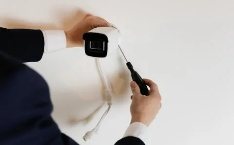 Installation of CCTV camera for home security. Videcam, smart home technology Stock Photos