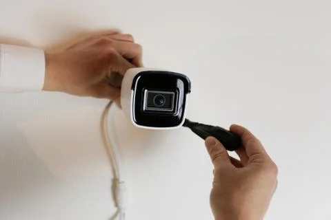 Installation of CCTV camera for home security. Videcam, smart home technology Stock Photos