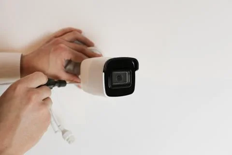 Installation of CCTV camera for home security. Videcam, smart home technology Stock Photos