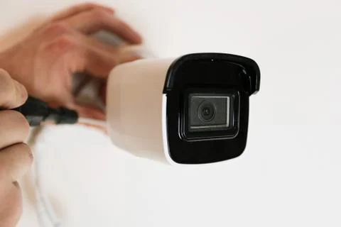 Installation of CCTV camera for home security. Videcam, smart home technology Stock Photos
