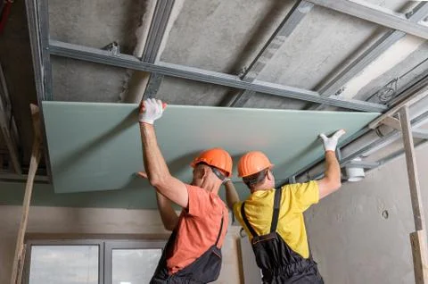 Installation of ceiling drywall. Stock Photos