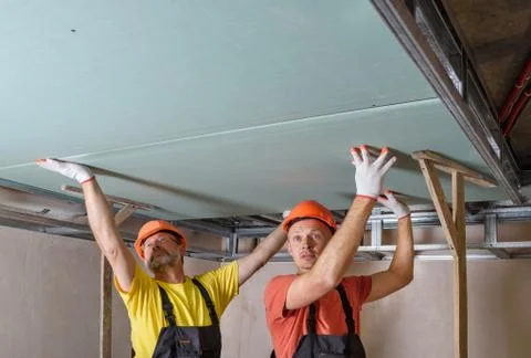 Installation of ceiling drywall. Stock Photos