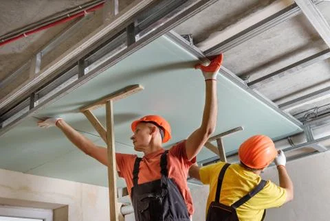 Installation of ceiling drywall. Stock Photos