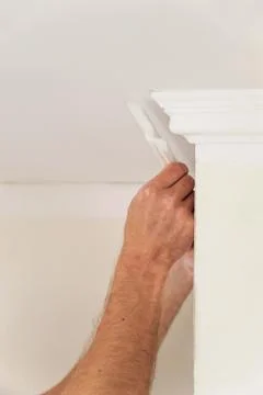 Installation of ceiling moldings. Stock Photos