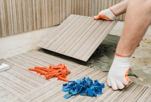 Installation of ceramic tiles. Stock Photos