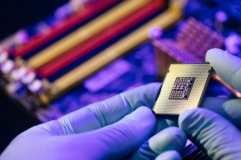 Installation of computer processor in the socket. Microprocessor with clearly Stock Photos