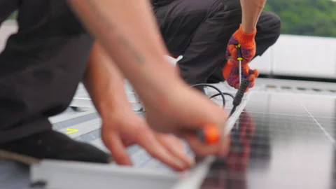 Installation, Connection and mounting of solar panels. Two workers fasten solar 스톡 동영상 161166338