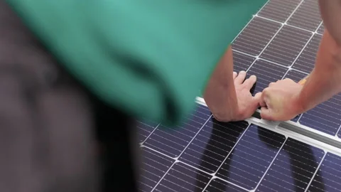 Installation, Connection and mounting of solar panels. Workers fasten solar Stock Footage 161167404