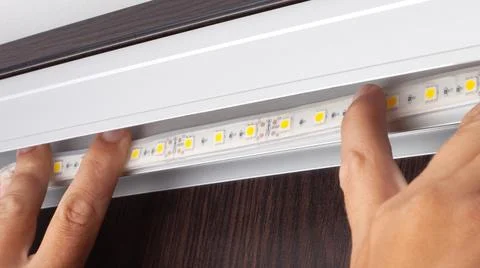 Installation of decorative LED strip. diode line mounting Stock Photos