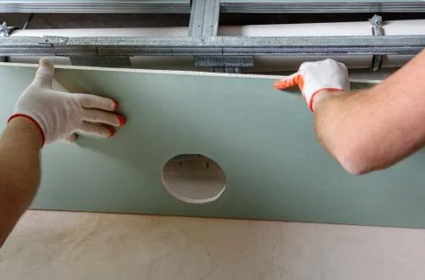 Installation of drywall. Stock Photos