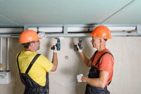 Installation of drywall. Stock Photos