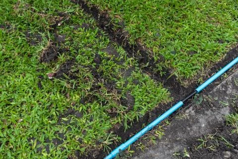 Installation of electric wire or cable on ground Stock Photos