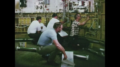 Installation of the electrical and telemetry systems for the Saturn third stage Stock Footage 297182848
