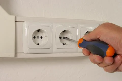 Installation of an electrical connector. Stock Photos