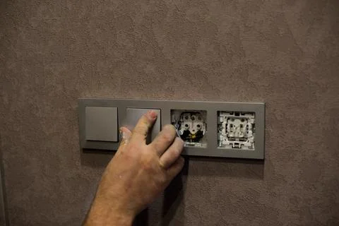 Installation of electrical outlets in the interior after a beautiful repair Stock Photos
