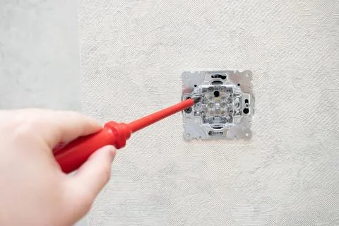 Installation of an electrical switch Stock Photos