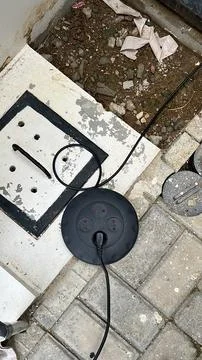 Installation of an Electrical System with a black power Socket and Cable on the Stock Photos