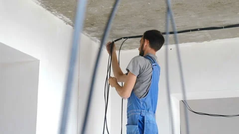 Installation of electrical wiring on apartment ceiling. Electrical cable system Stock Footage 159633815