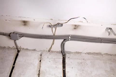 Installation of electrical wiring on the ceiling. Stock Photos